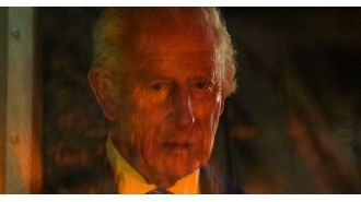 Humorous meme created from King Charles gazing at a fire.