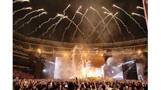 Fan at Travis Scott's concert has seizure amidst chaos and fighting among the crowd.