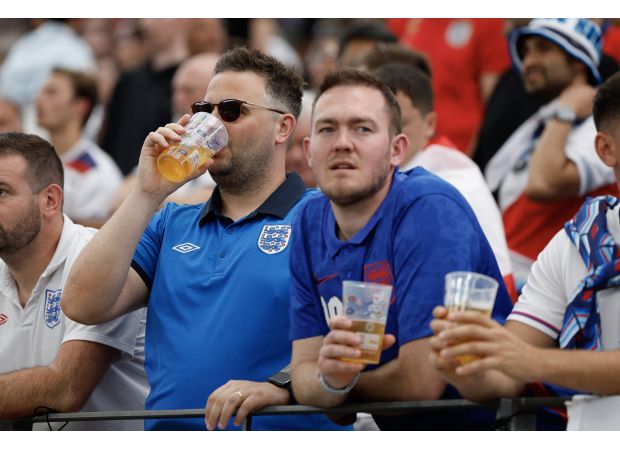 Possible paraphrase: UK soccer games will experiment with allowing alcohol consumption in the stands.