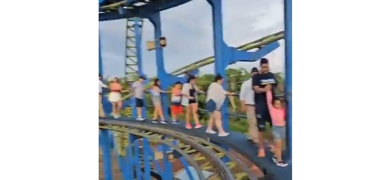 Scared riders exit rollercoaster on foot after being stuck 70ft above ground.