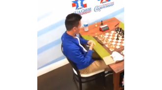 A top chess player was removed from competition after hitting a woman recording his match.