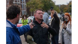 Tommy Robinson, a far-right activist, has been charged with a terrorism offense before a planned march by his supporters in London.