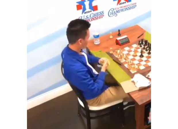 A top chess player was removed from competition after hitting a woman recording his match.
