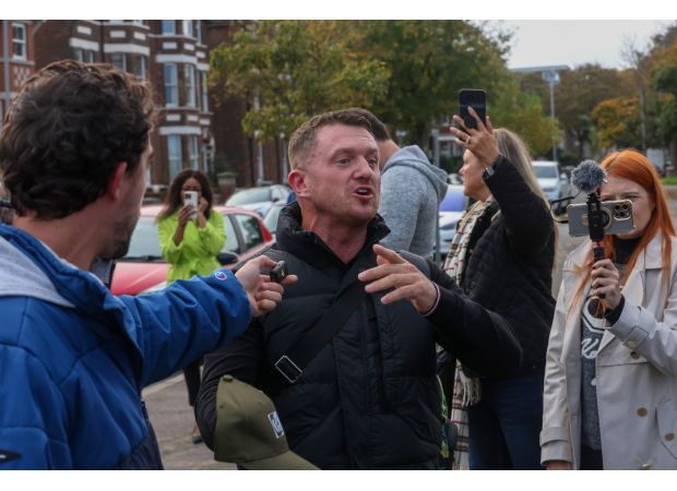 Tommy Robinson, a far-right activist, has been charged with a terrorism offense before a planned march by his supporters in London.