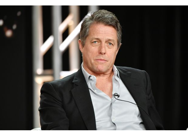 Hugh Grant jokes about his past lewd conduct arrest while attending the premiere of Heretic.