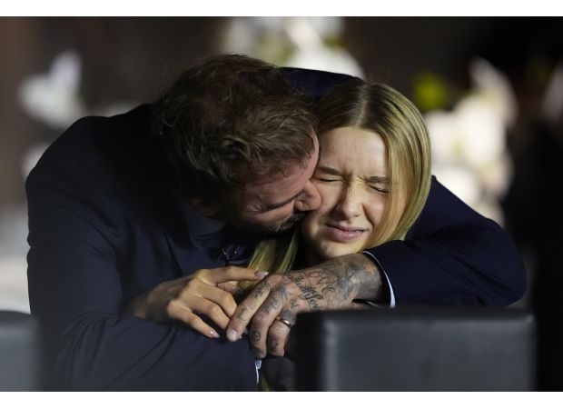 Soccer star David Beckham's heartwarming moment with his 13-year-old daughter Harper on a family day out.