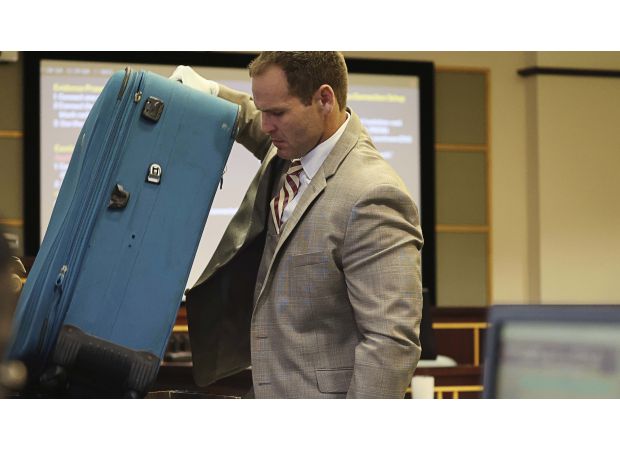 Woman convicted of second-degree murder for zipping her boyfriend in suitcase.