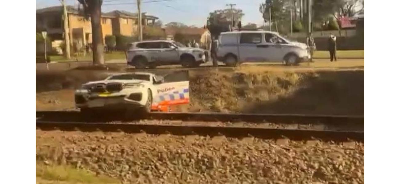 Cops escape train while pursuing biker in Sydney.