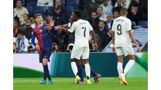 Young soccer star Vinicius Junior responds to a Barcelona player's criticism by reminding them of his potential to win the prestigious Ballon d'Or award.