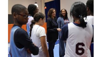 Harris urges America to move past hate and strife while traveling through Philadelphia.
