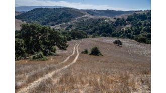 Environmentalists acquire section of large ranch in Santa Clara County that has been at the center of a dispute over mining.