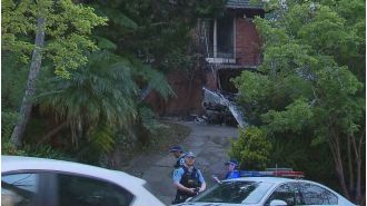 Cops probe fire that injured resident, firefighter