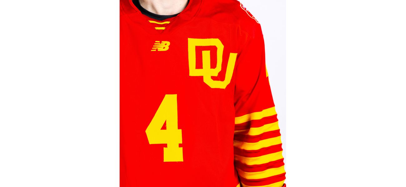 Denver hockey honors 75th anniversary with red and yellow uniform.