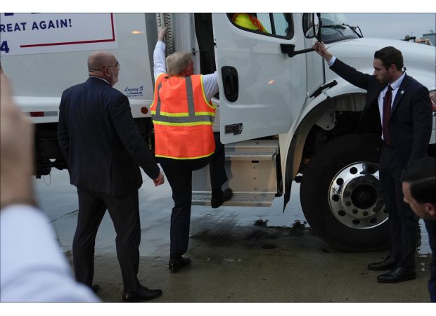 Trump's attempt to troll Biden and Harris fails as he misses the garbage truck handle and stumbles.