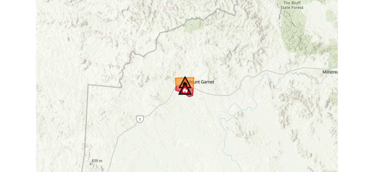 A big fire in Queensland's Tablelands triggers evacuation warnings.