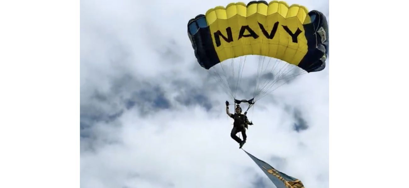 Footage depicts pre-crash scene of Navy parachutist colliding with family at Fleet Week event.