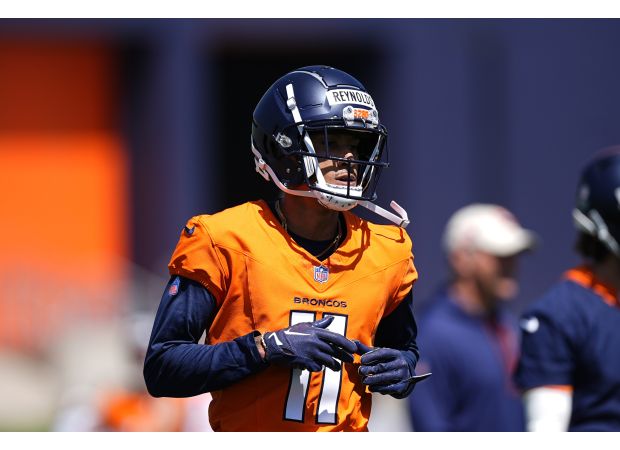 Two men accused of trying to kill and harm Josh Reynolds, a player for the Broncos, have been charged with attempted murder and assault.