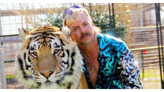 Exotic from Tiger King announces engagement to much younger man while still in prison.