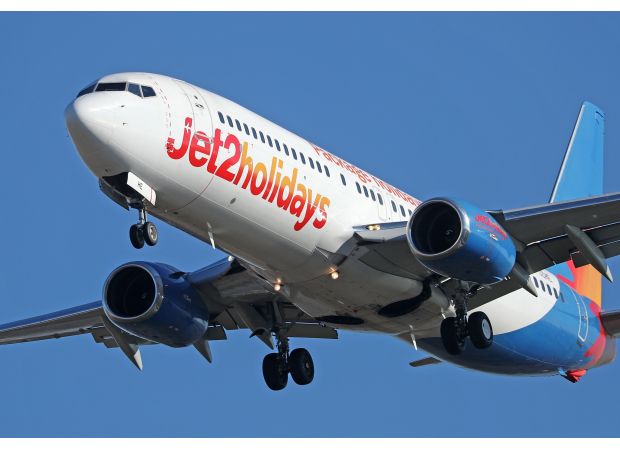 An airplane was forced to return when passengers became sick from a strong smell resembling burning.