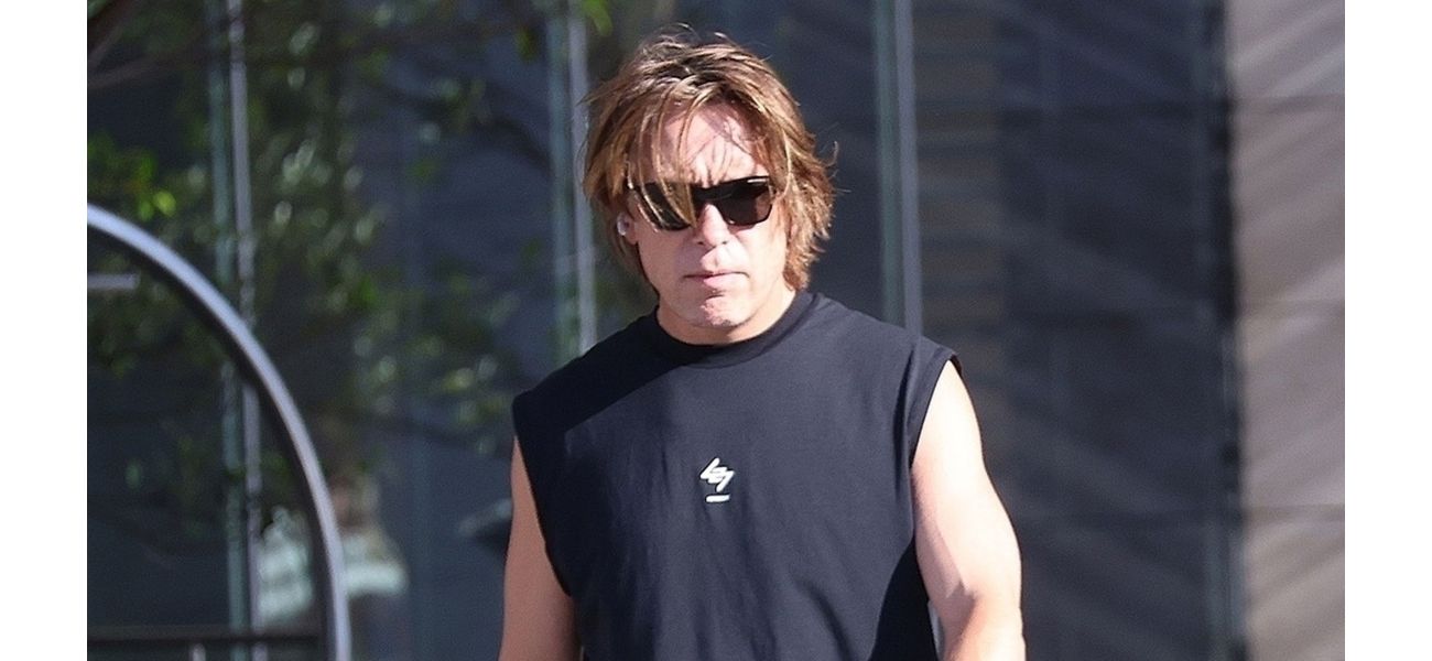 A 52-year-old 90s boyband star is almost unrecognizable as he prepares for a big concert.