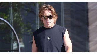 A 52-year-old 90s boyband star is almost unrecognizable as he prepares for a big concert.