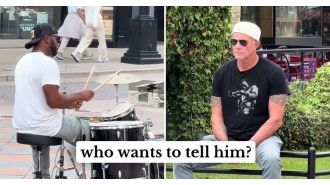 Street performer jams to RHCP but doesn't know the drummer is watching.
