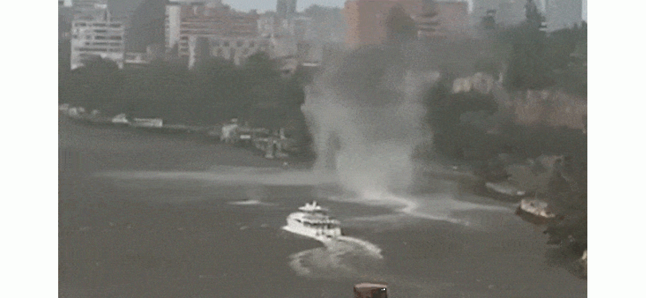 A breathtaking scene as a gustnado tears through Brisbane River amidst a fierce storm.