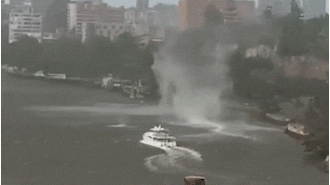 A breathtaking scene as a gustnado tears through Brisbane River amidst a fierce storm.