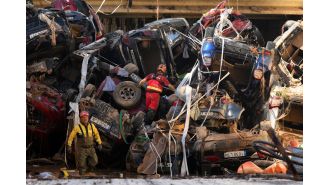 Spain deploys troops to Valencia after flood victims stranded on lampposts.