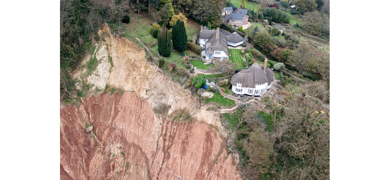 A cottage is in danger of falling off a 400ft cliff due to a huge landslide.