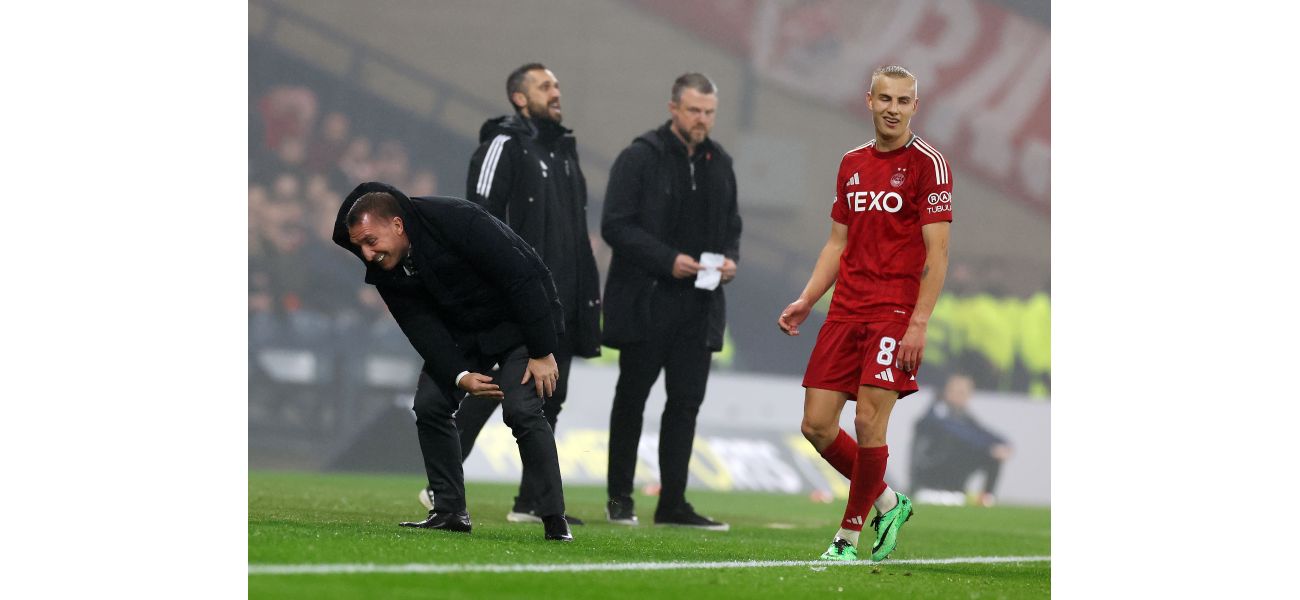 Celtic's Brendan Rodgers falls while kicking ball in victory over Aberdeen.