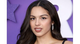 Real Madrid fans mistakenly assault singer Olivia Rodrigo, confusing her for a Manchester City player.