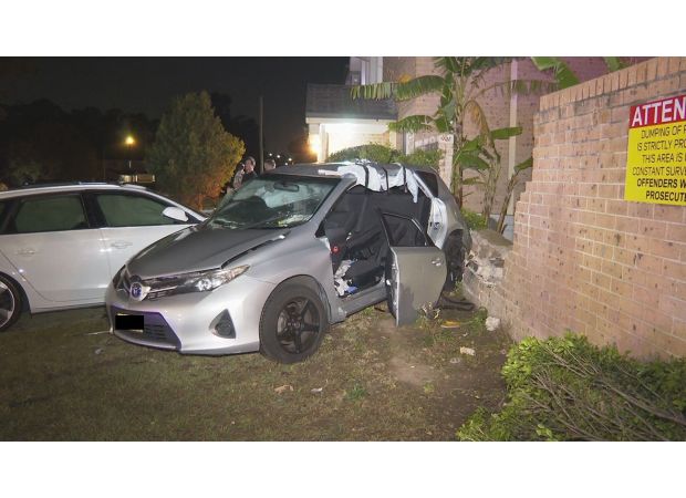 Two cars collide with brick fence, causing chaos in Sydney's western region.