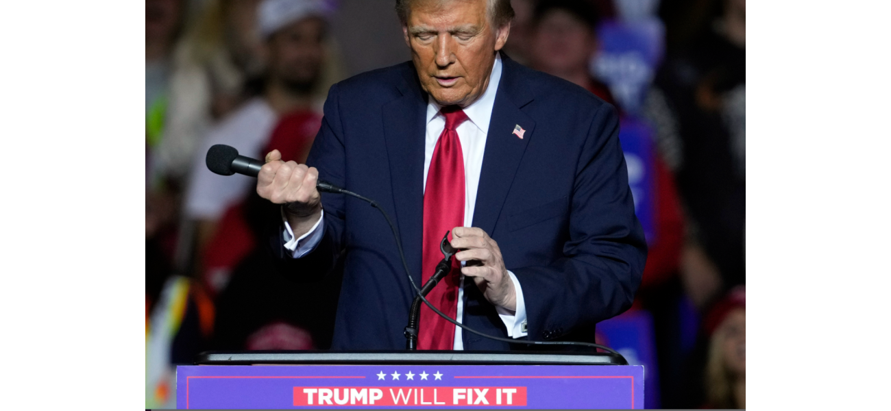 Trump made strange movements with microphone after technical issues at rally.