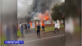 Man hospitalized due to fire in Sydney residence.