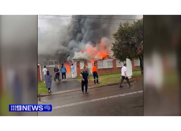 Man hospitalized due to fire in Sydney residence.
