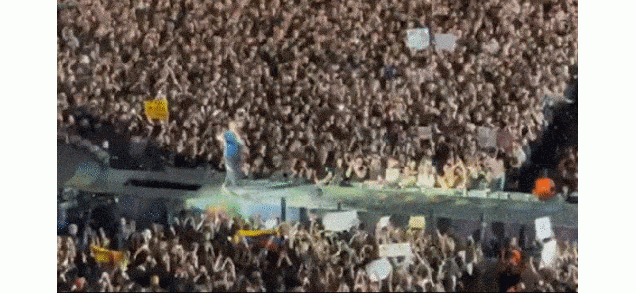 Lead singer of Coldplay surprises concertgoers with unexpected fall through stage opening.