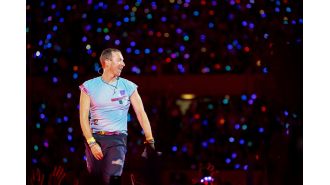 Chris Martin accidentally falls through stage hole in unexpected accident while performing.