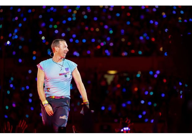 Chris Martin accidentally falls through stage hole in unexpected accident while performing.