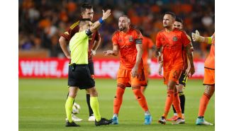 Legendary Mexican player ejected for spitting at referee in MLS game.