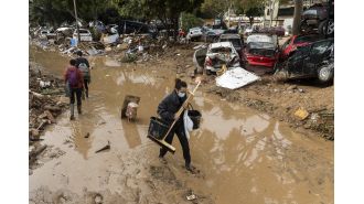 Rescue teams look for flood survivors in Barcelona amid heavy rainfall.