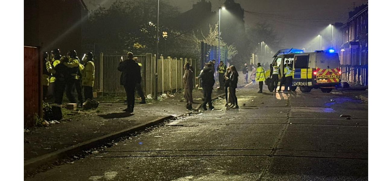 A group of young people throw fireworks at the police in Manchester.