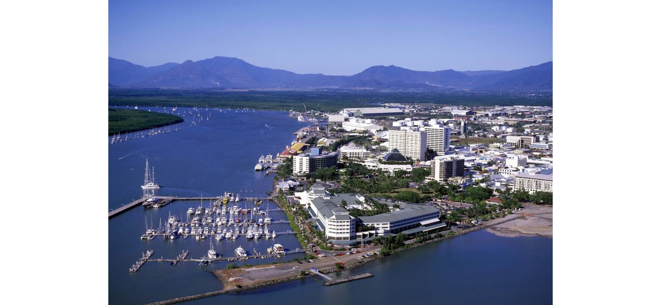 Two girls face charges after a woman in Cairns was reportedly threatened with scissors and physically attacked.
