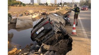 Mother and infant tragically swept away by floodwaters in Spain.