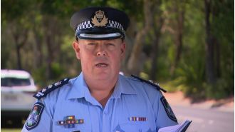 Police are monitoring a 16-year-old boy after a crash which resulted in a woman's death and injuries to police officers.