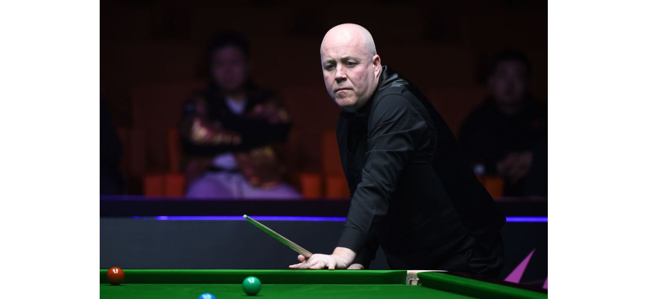 John Higgins was defeated in a tense match against Chris Wakelin and was upset with the referee during the game.