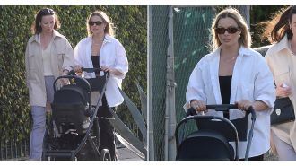 New mom Margot Robbie steps out with her newborn baby, marking her first child.