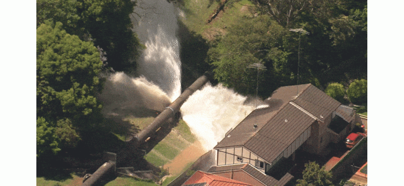 Water pipeline in Sydney breaks, flooding houses with a surge of water.