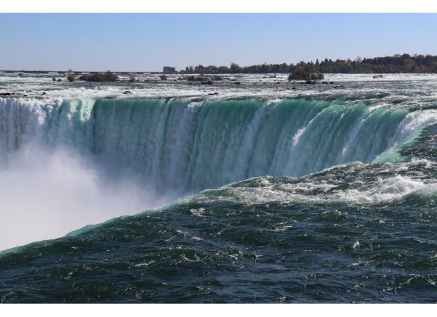 A second woman jumps into Niagara Falls river following a mother and two children's jump.