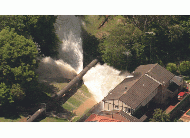 Water pipeline in Sydney breaks, flooding houses with a surge of water.